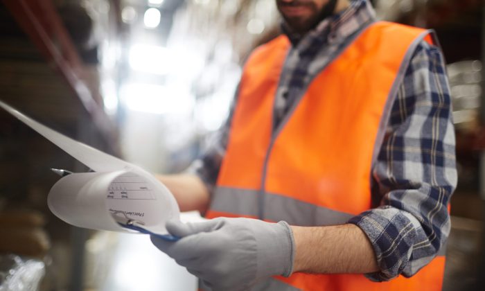 Supervisor reading document at work